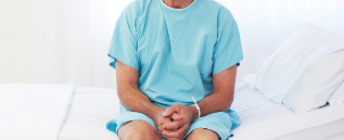 a man sitting in a hospital bed
